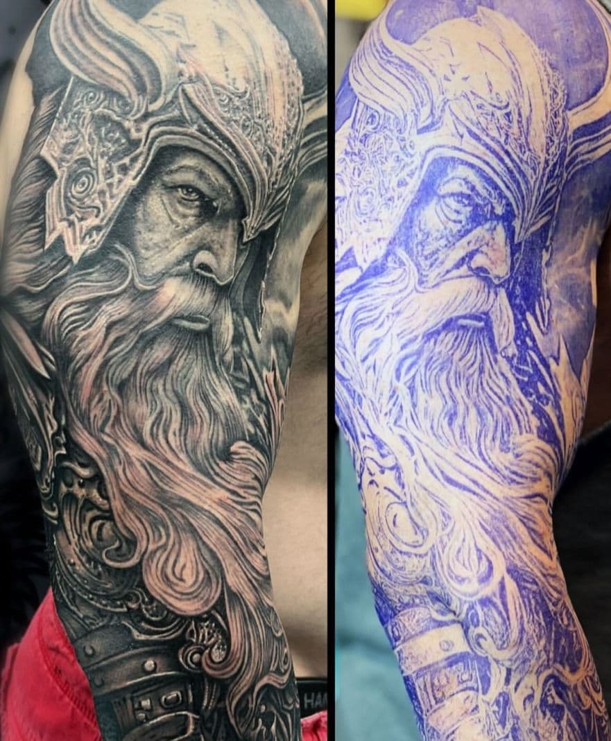 Black and grey realistic Viking warrior sleeve on upper arm