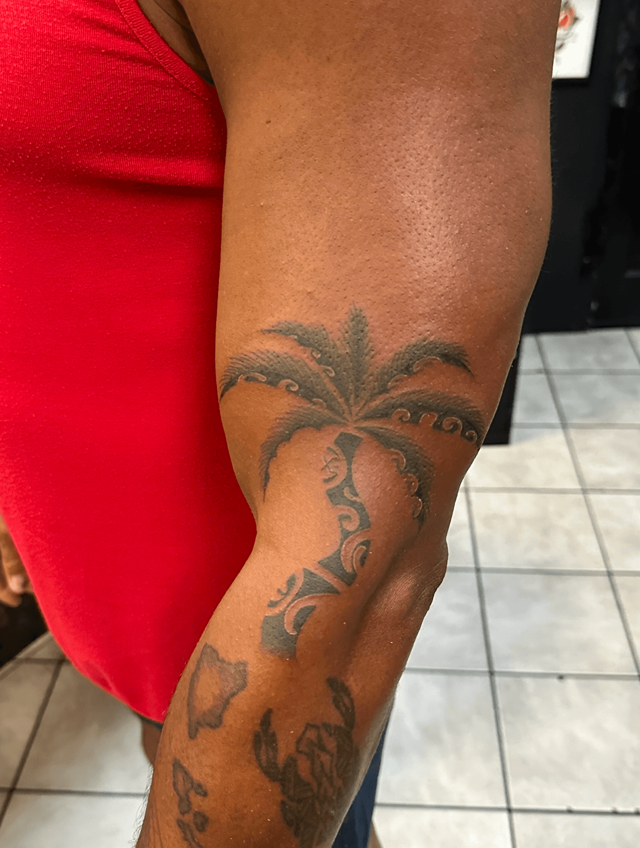 Blackwork tribal tattoo on forearm