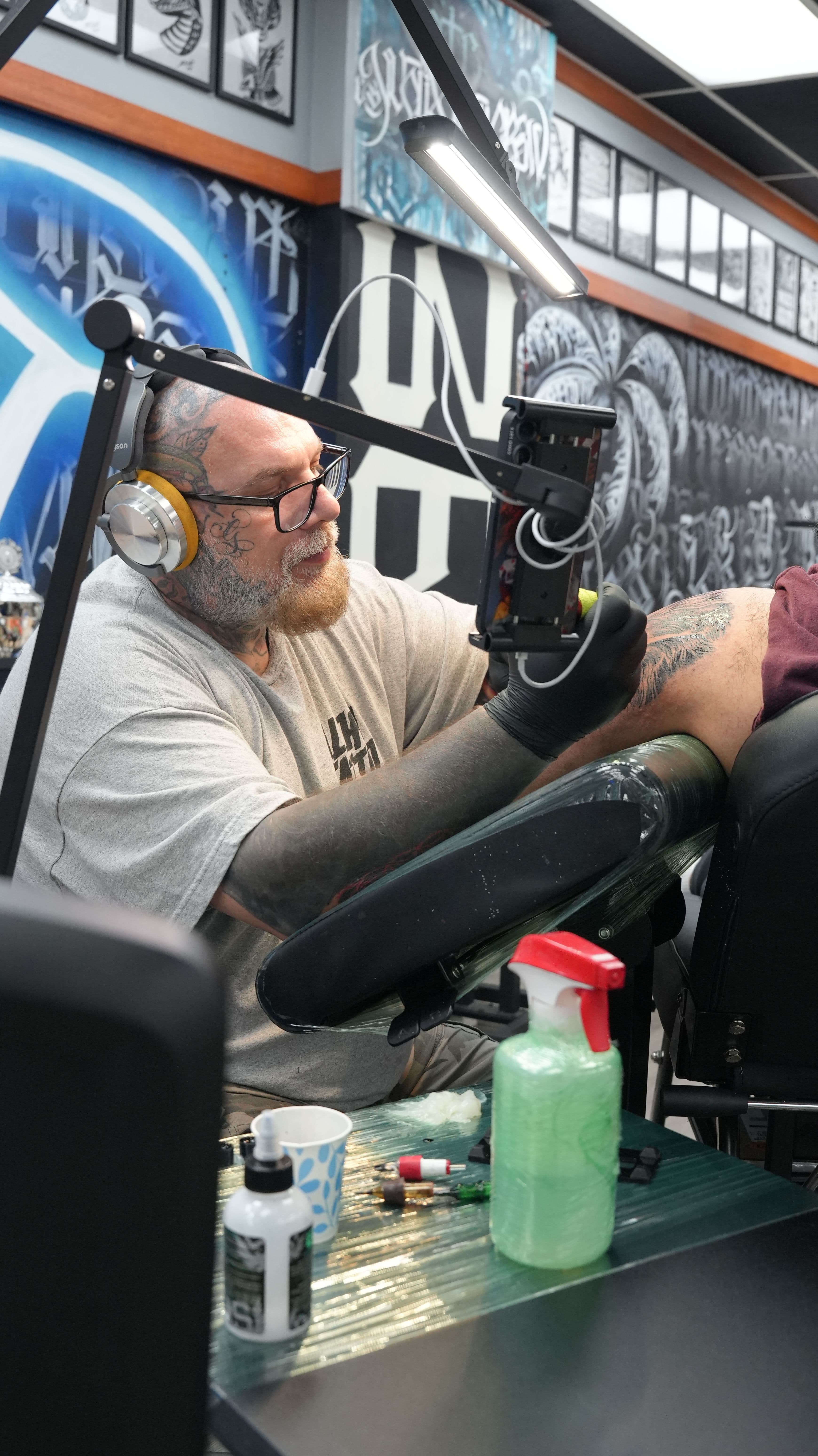 Black and grey blackwork tattoo on upper thigh